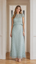 Model wearing sage green floral lace maxi dress, front view