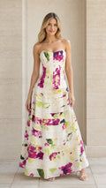 Front view of model wearing ivory strapless floral tiered maxi evening gown