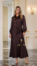 Front view of brown satin blouse and maxi skirt set