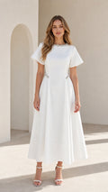 Front view of woman wearing white pearl embellished A-line midi dress with flutter sleeves