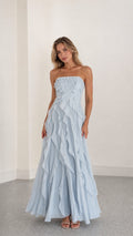 Front view of model wearing light blue strapless ruffle maxi dress