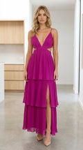 Front view of model wearing Fuchsia pleated tiered cutout maxi dress