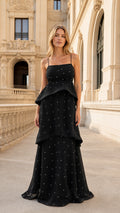 Front view of black pearl-embellished tiered maxi dress