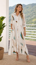 Front view of model wearing white feather print maxi shirt dress