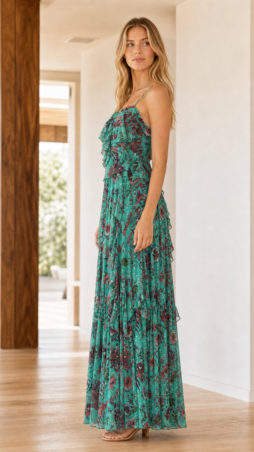 Side profile view of model wearing Teal floral maxi dress