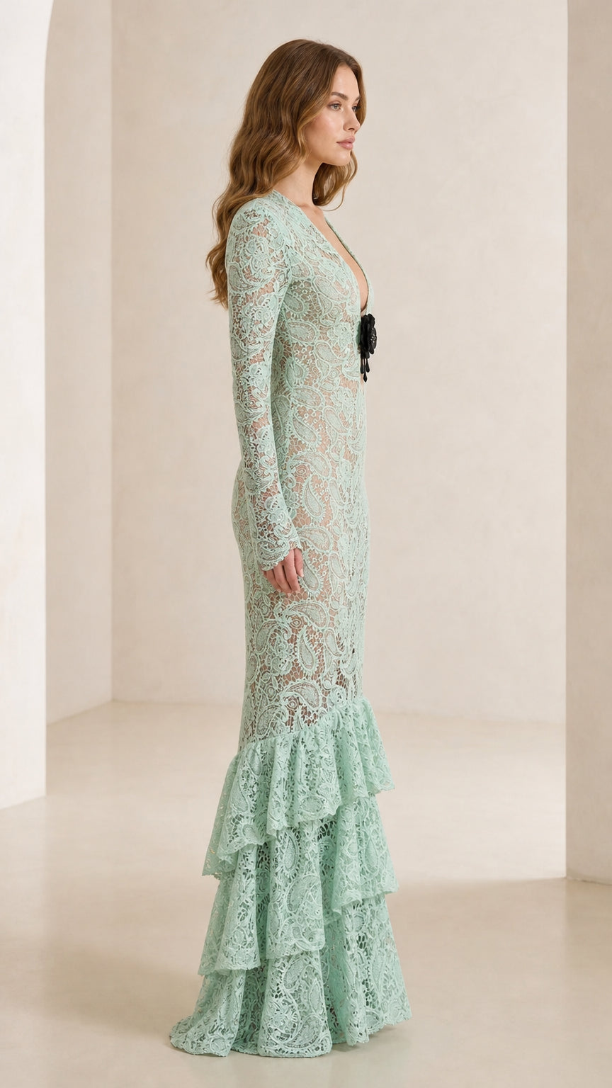 Side profile of model in mint green lace mermaid dress