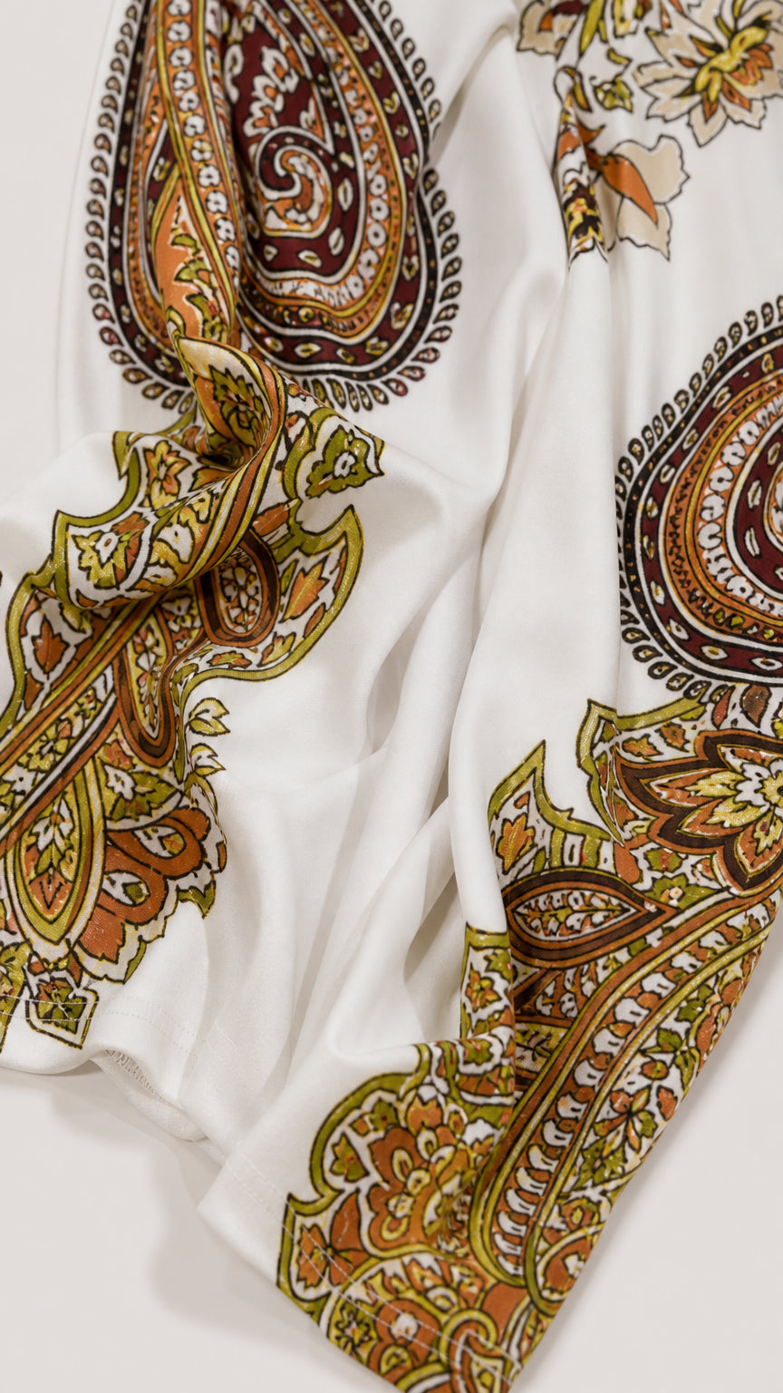 Close-up of smooth fabric texture and paisley pattern