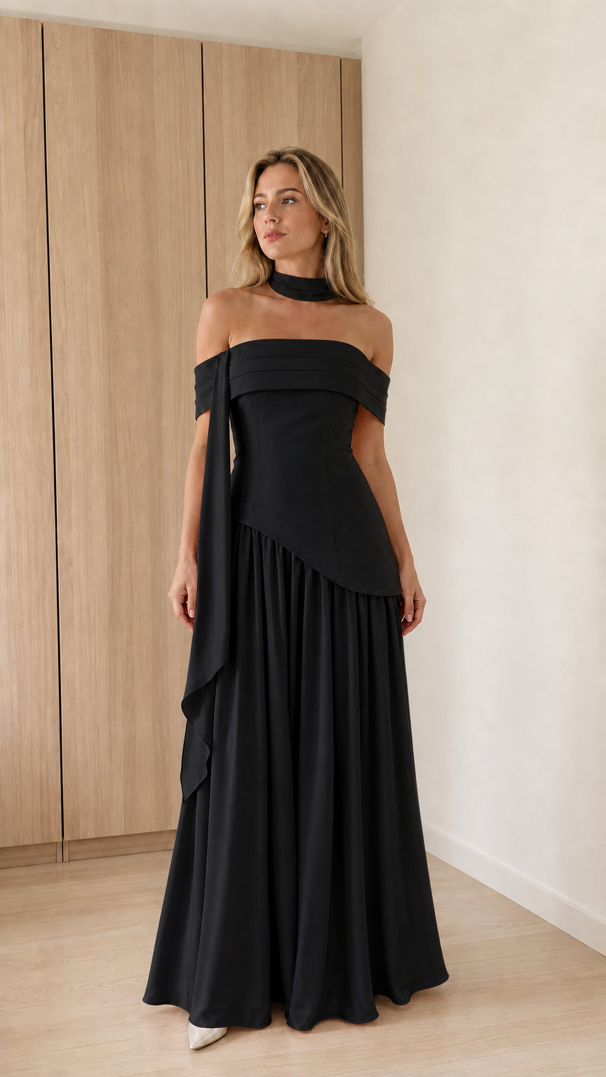 Model wearing black off-the-shoulder maxi dress