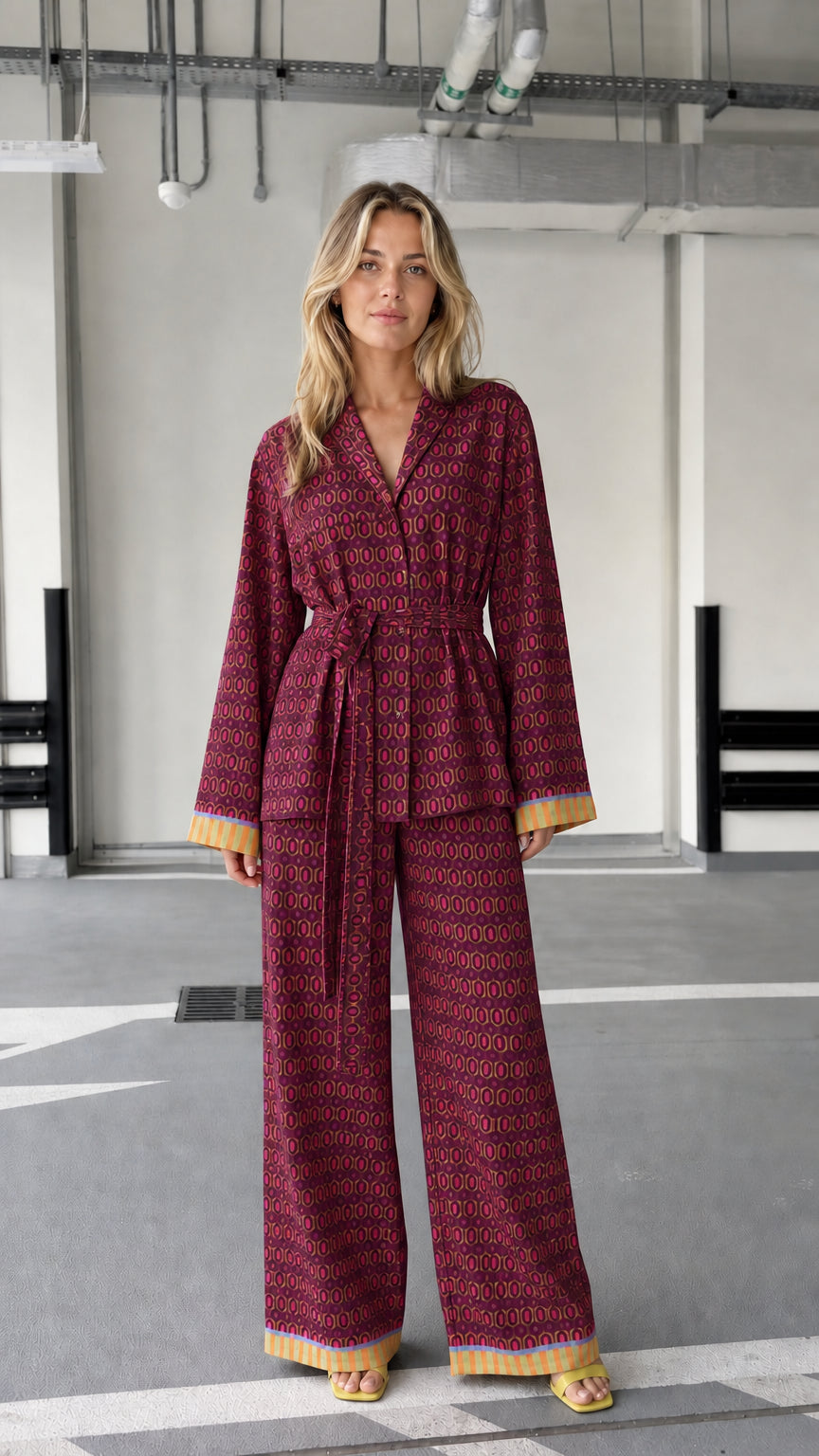 Woman wearing burgundy patterned two-piece lounge set